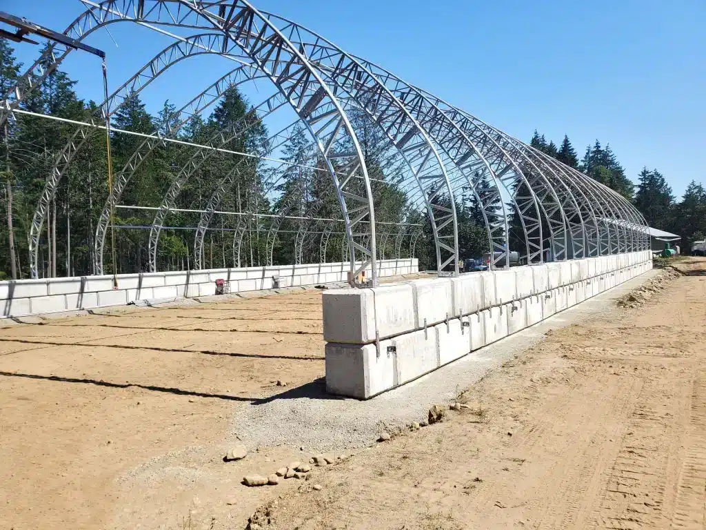 Concrete block foundation for a MegaDome fabric building