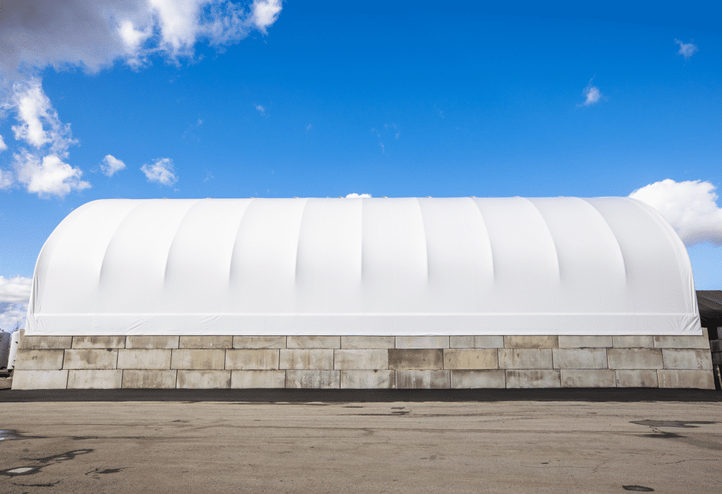 Concrete block foundation for a MegaDome fabric building